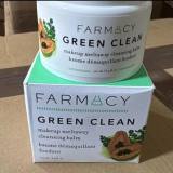 A jar of Farmacy Green Clean herbal supplement placed on top of its green and white cardboard packaging box.