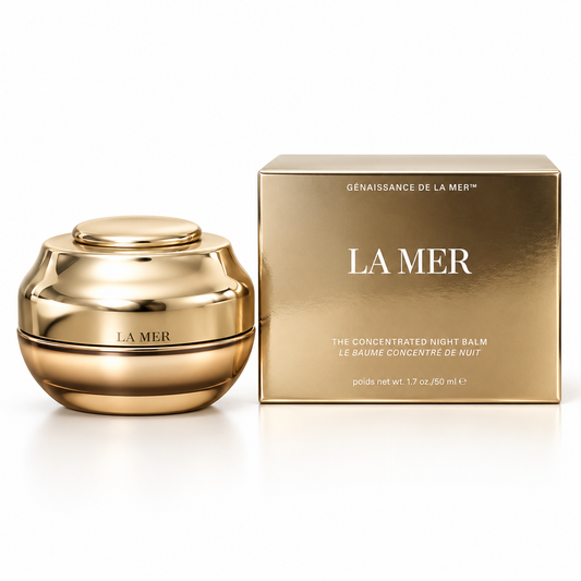 La Mer The Concentrated Night Balm jar in a reflective gold finish, shown next to its matching gold packaging box on a clean white background.