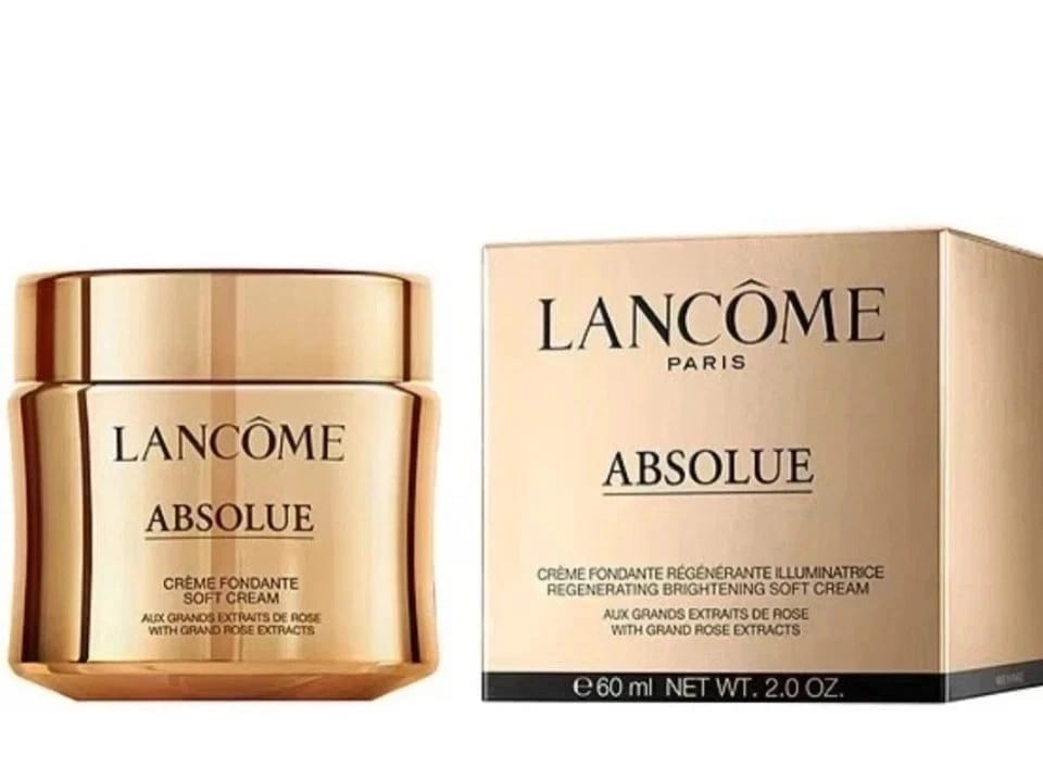 Lancôme Absolu skincare cream jar in gold with a matching gold and black box on a white background.