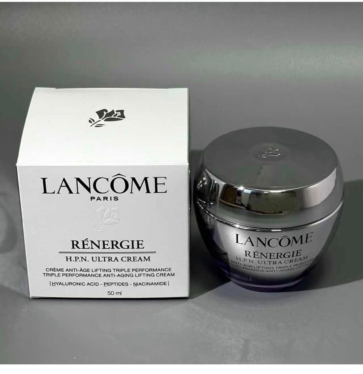 Lancôme Rénergie H.P.N. Ultra Cream 50ml jar next to its white packaging box on a gray background.
