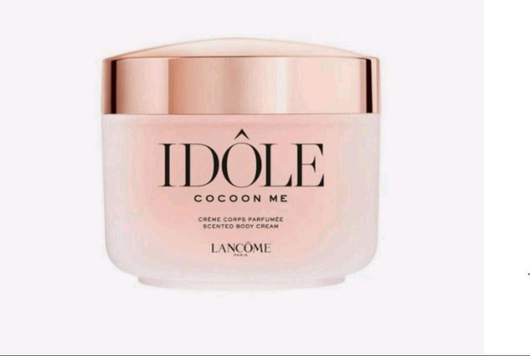 Lancome Idôle Cocoon Me scented body cream in a frosted glass jar with a metallic rose gold lid, set against a plain white background.