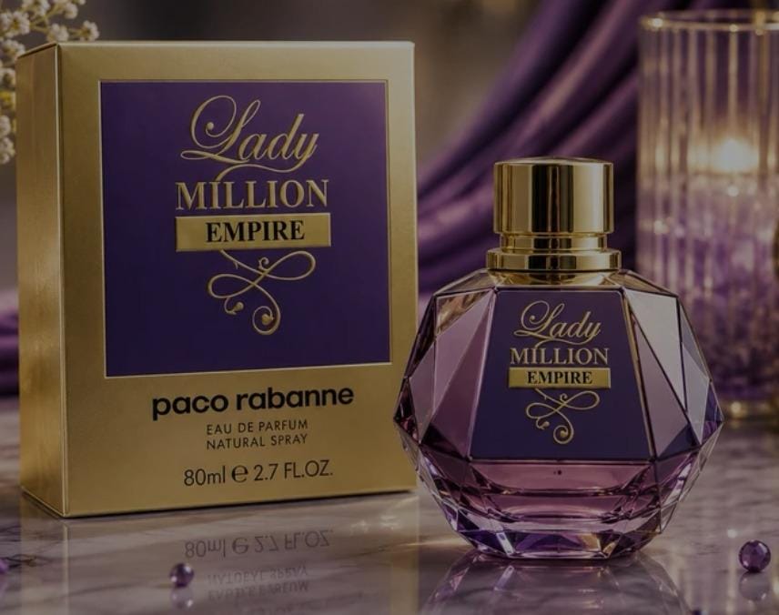 Paco Rabanne Lady Million Empire Eau de Parfum bottle and its original packaging box, featuring a faceted purple glass design and gold accents, set against a purple draped background.